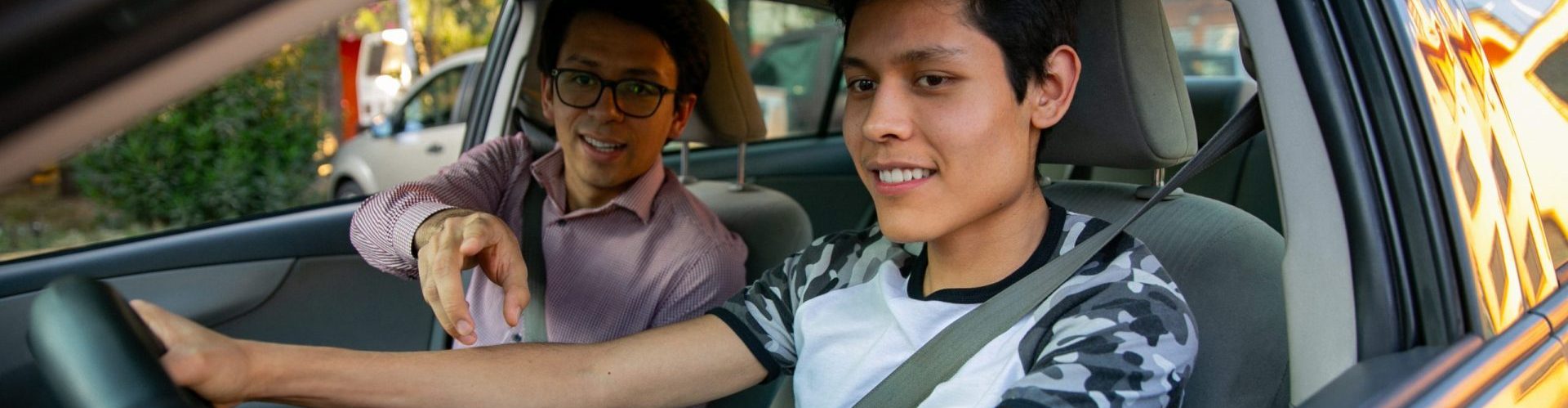 two young men in a driving lesson