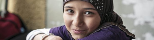 syrian refugee girl looking at camera