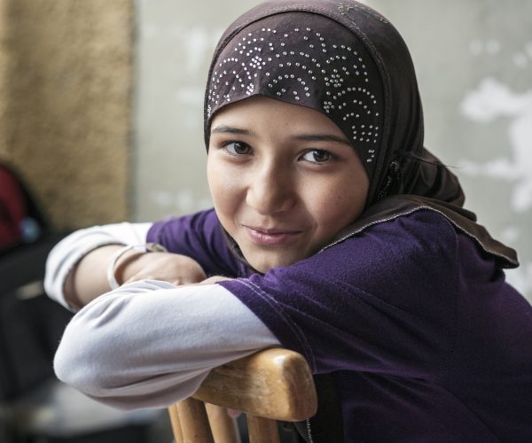 syrian refugee girl looking at camera