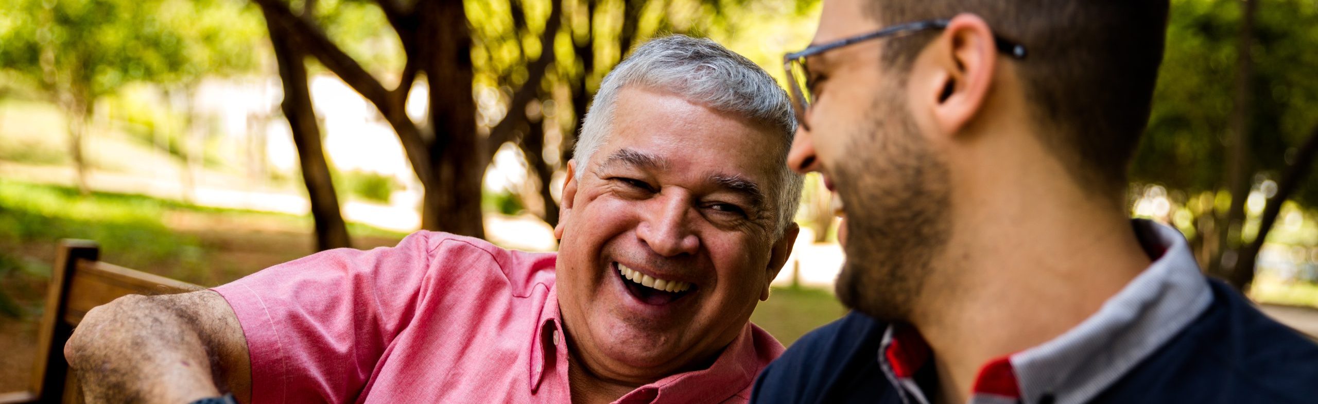 man laughing with younger man