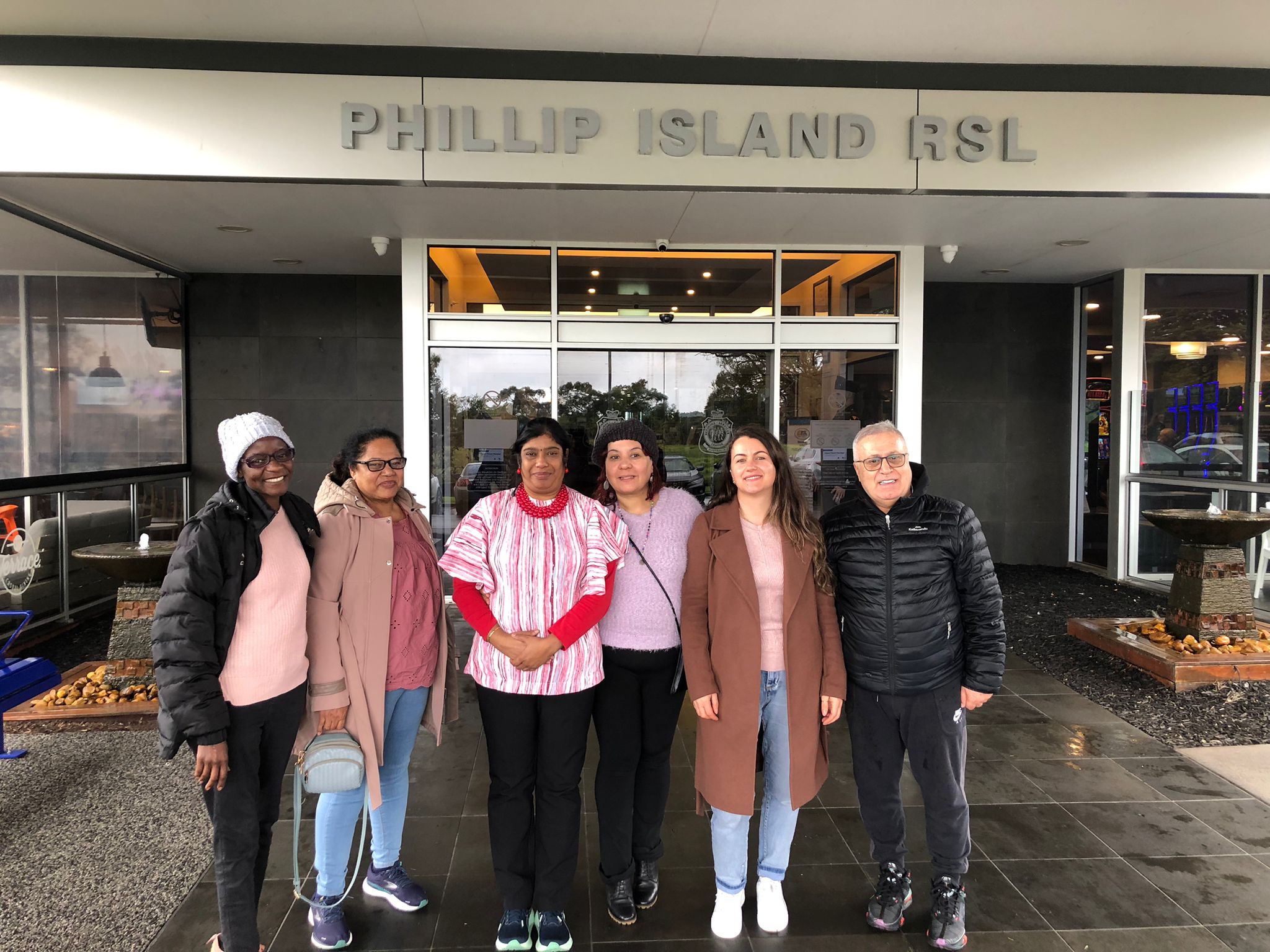 The group stands out the front of the Philip Island RSL with big smiles on their faces.