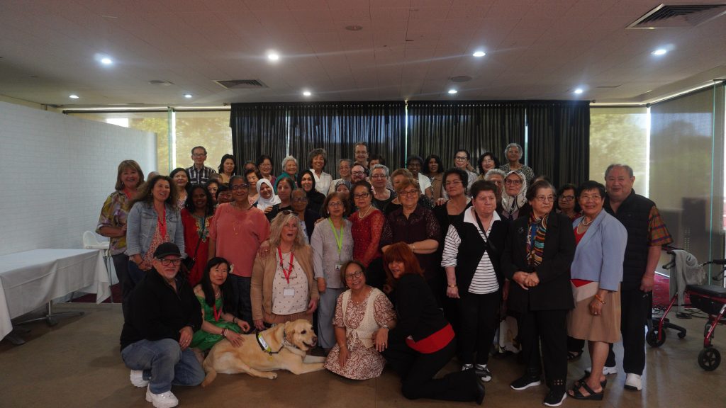 All the attendees smiling in a group photo