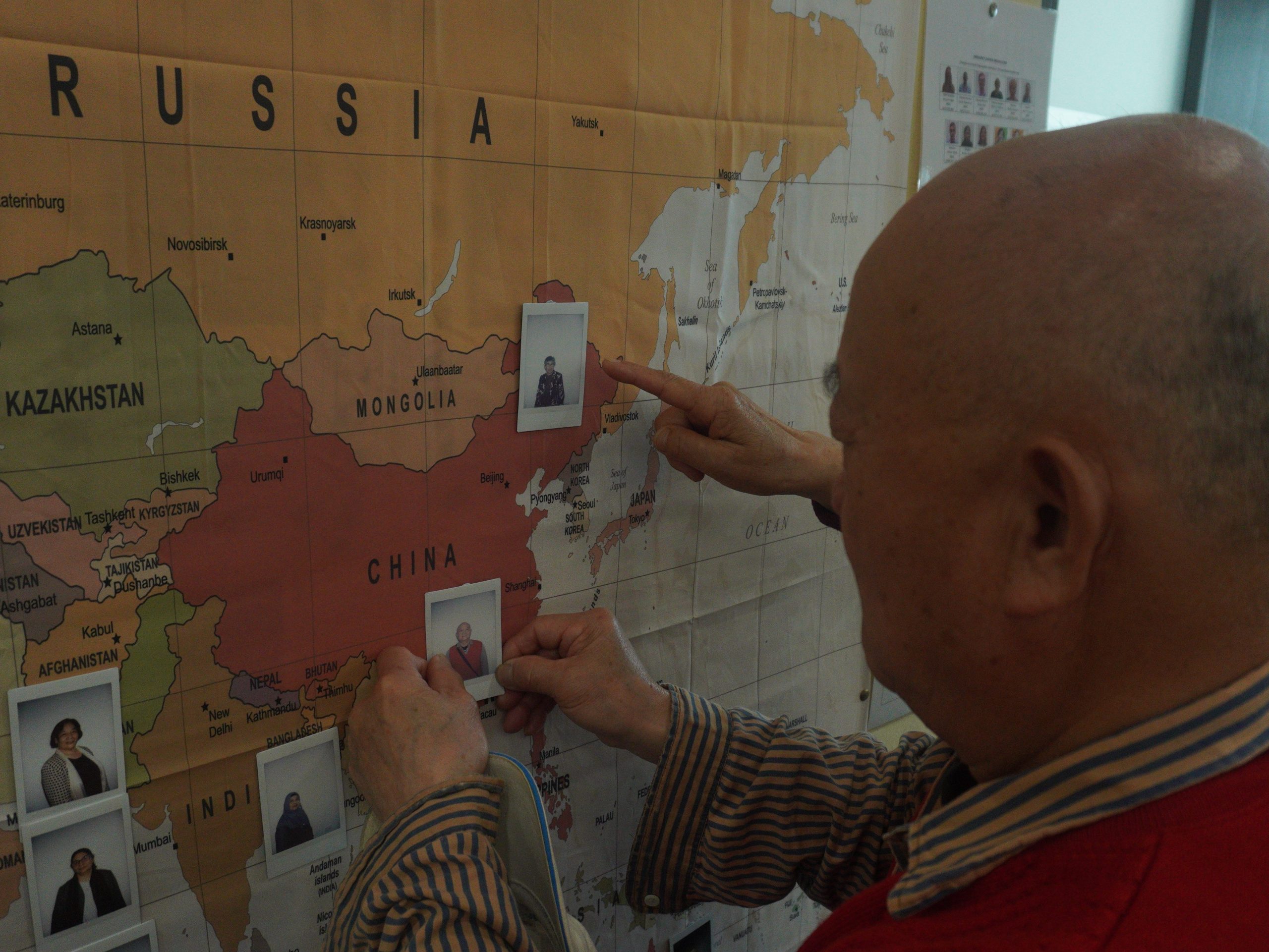 One carer is pinning their photo to the world map